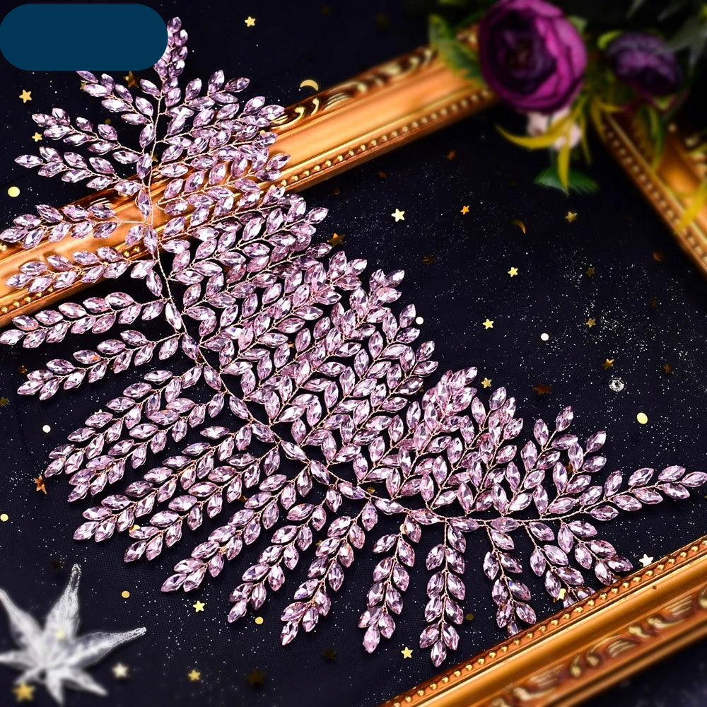 Pink crystal bridal hair vine with delicate leaf motifs on a gold frame