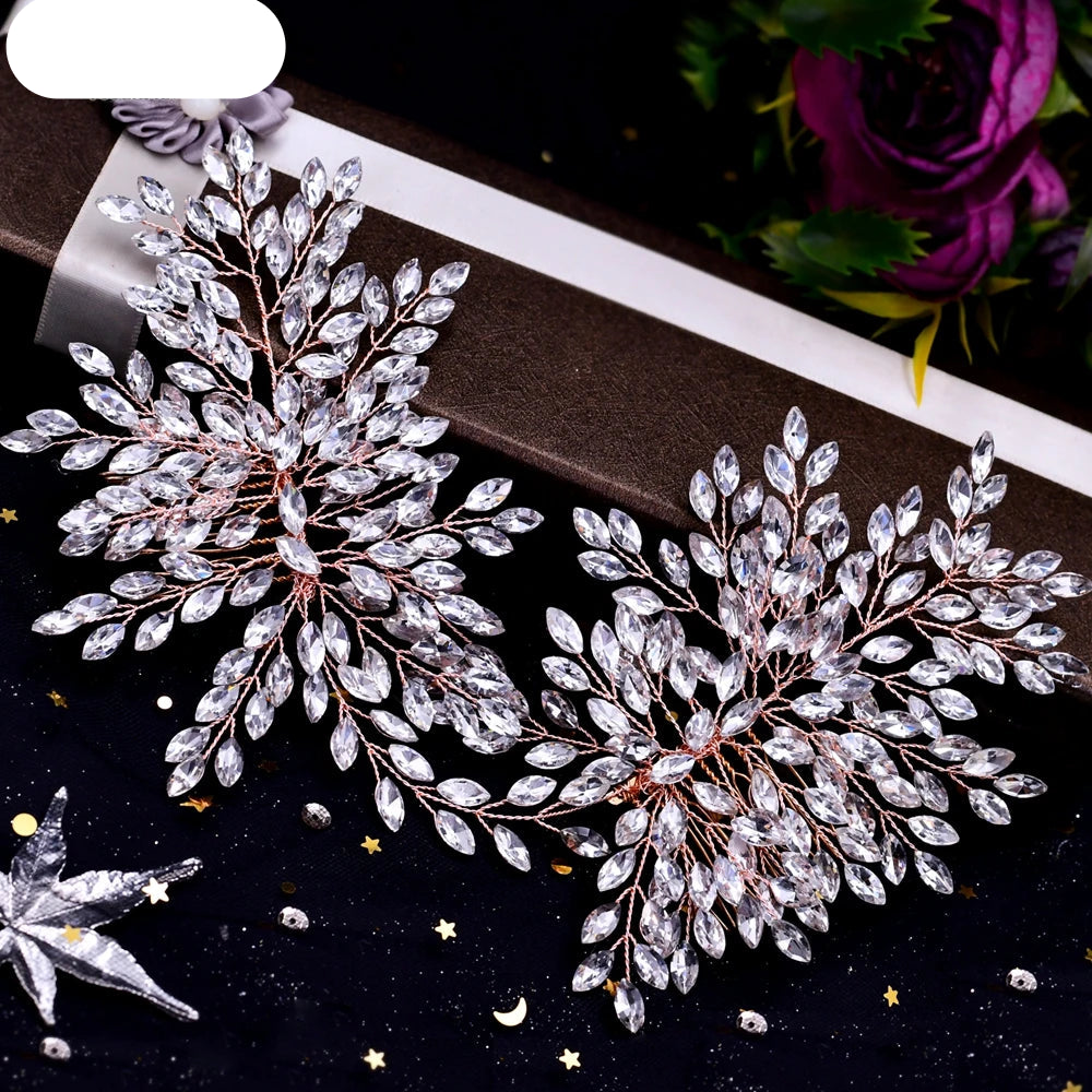 Pair of rose gold crystal leaf bridal hairpieces displayed together