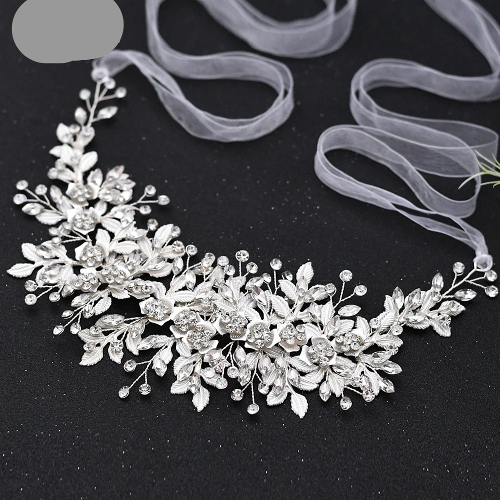 Delicate silver floral bridal hair vine with crystal details and soft ribbon ties