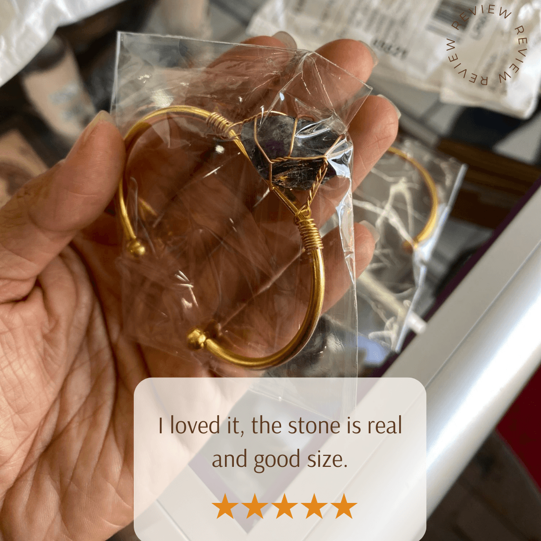 Customer review showing a packaged copper bracelet with a wire-wrapped crystal quartz stone.