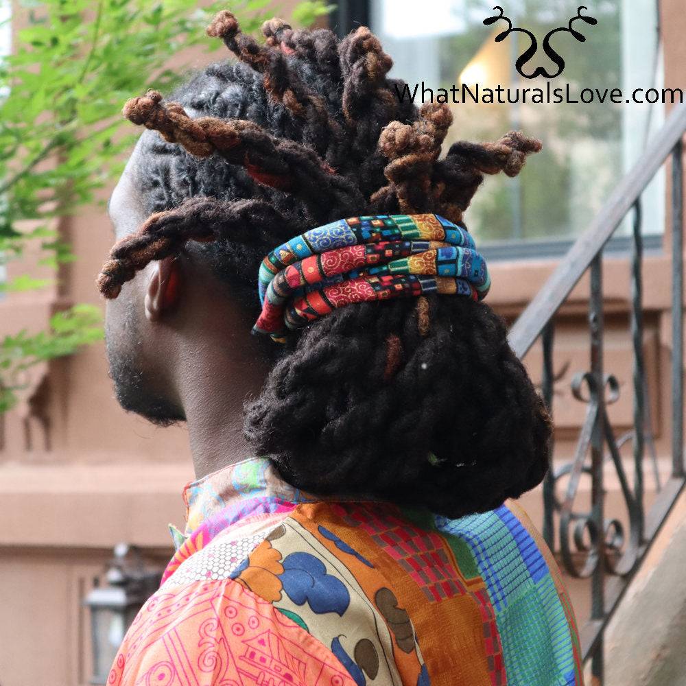 Moldable hair tie securing thick locs in a stylish updo. Perfect for dreadlocks, braids, and Sisterlocks, offering a secure and adjustable hold.
