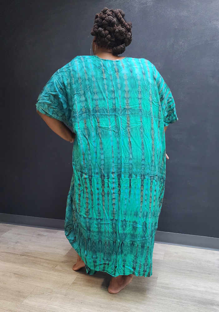 Back view of a green tie-dye kimono jumpsuit, showcasing its loose fit and flowing fabric. Ideal for plus-size comfort and elegance.