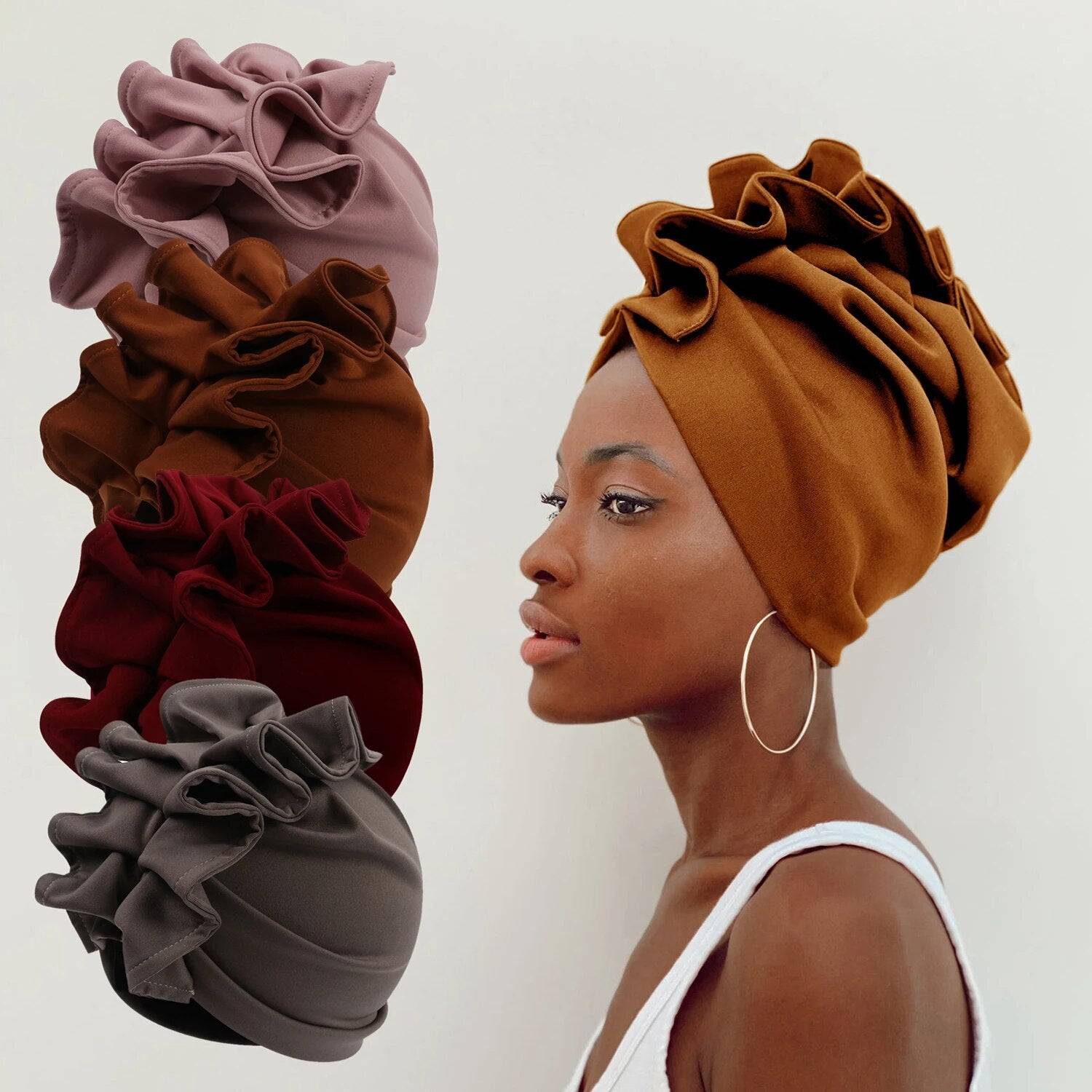 Rosette Radiance Premade Headwrap in multiple colors, featuring a stylish ruffled design. Perfect for adding sophistication to any outfit.