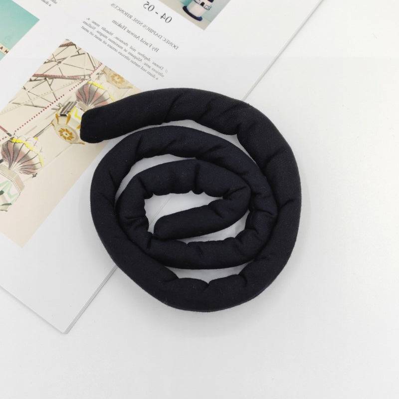 Solid black moldable hair tie for locs and braids. A versatile and tension-free hair accessory for natural hairstyles.