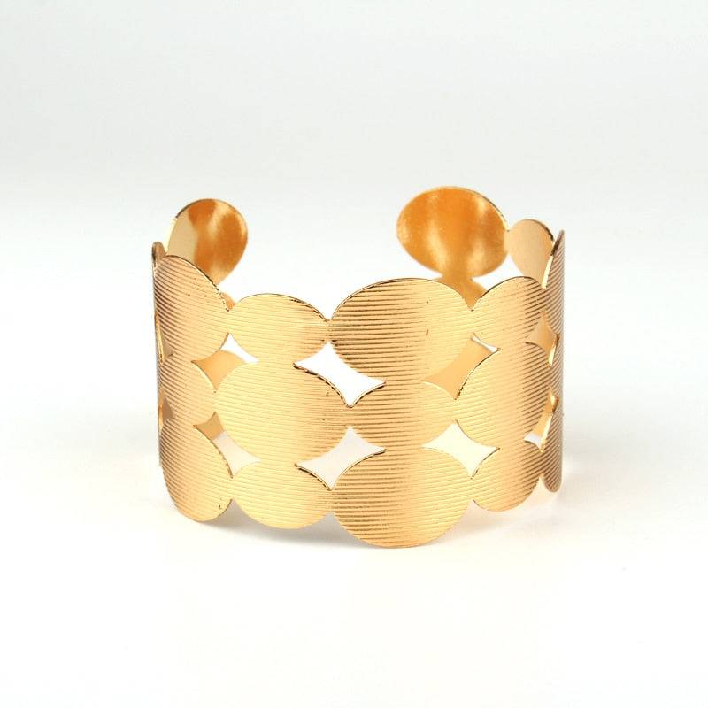 Wide gold-tone hair cuff with a scalloped cut-out design for locs, sisterlocks, dreadlocks, and braids. Non-damaging and stylish hair accessory.
