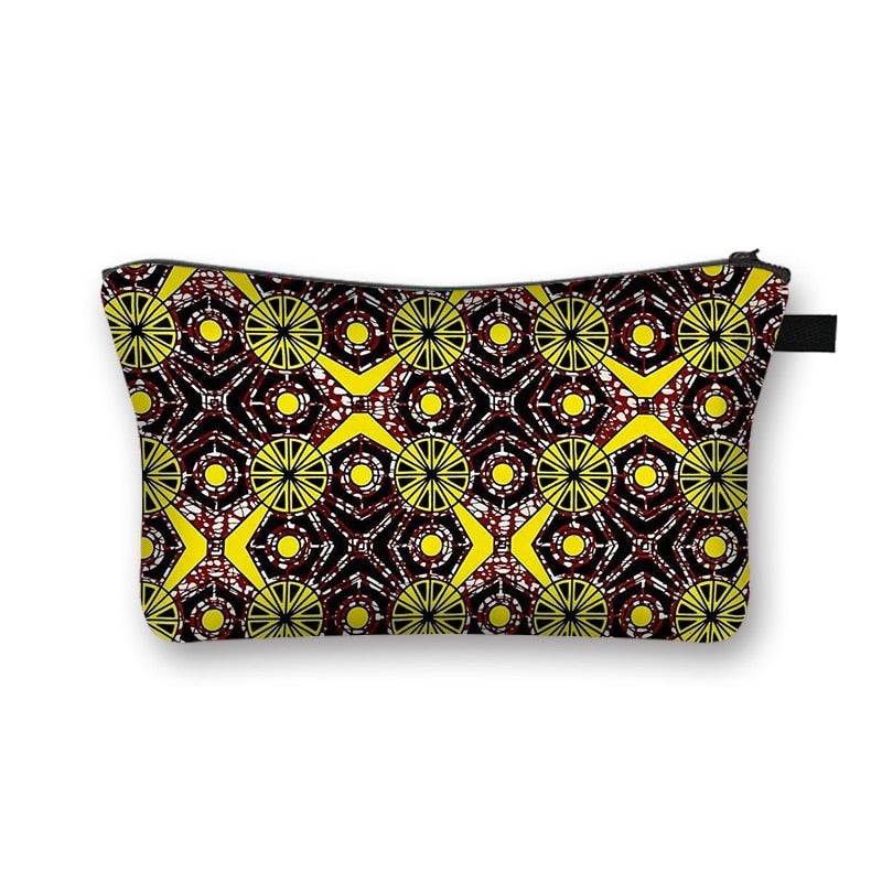 Black and yellow African print makeup bag with intricate circular designs. Durable and stylish cosmetic pouch with a secure zipper.