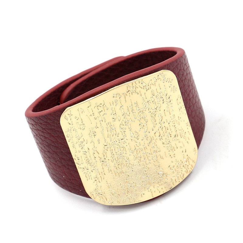 Burgundy leather hair cuff with a textured gold plate, designed for locs, sisterlocks, and dreadlocks. A stylish and secure hair accessory.