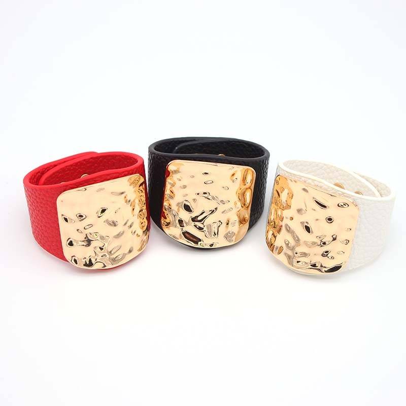 Set of three leather hair cuffs in red, black, and white with hammered gold plates, designed for locs, sisterlocks, and dreadlocks. Stylish and non-damaging.