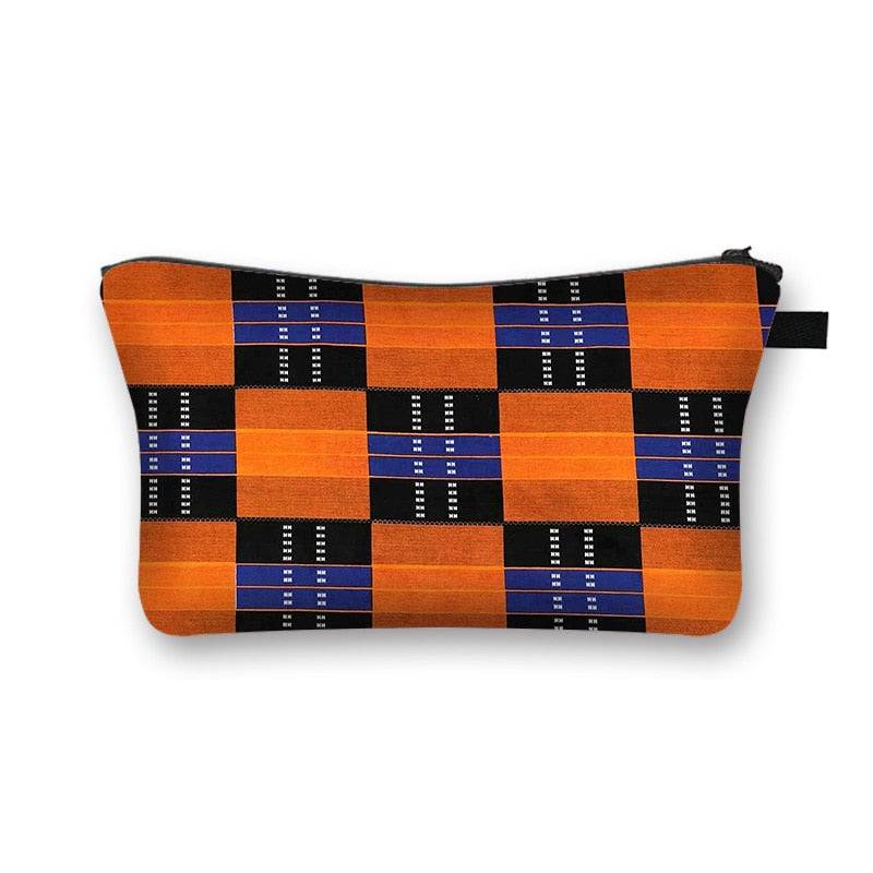 Orange and black checkered African print makeup bag. Durable and stylish cosmetic pouch with a secure zipper and lining.