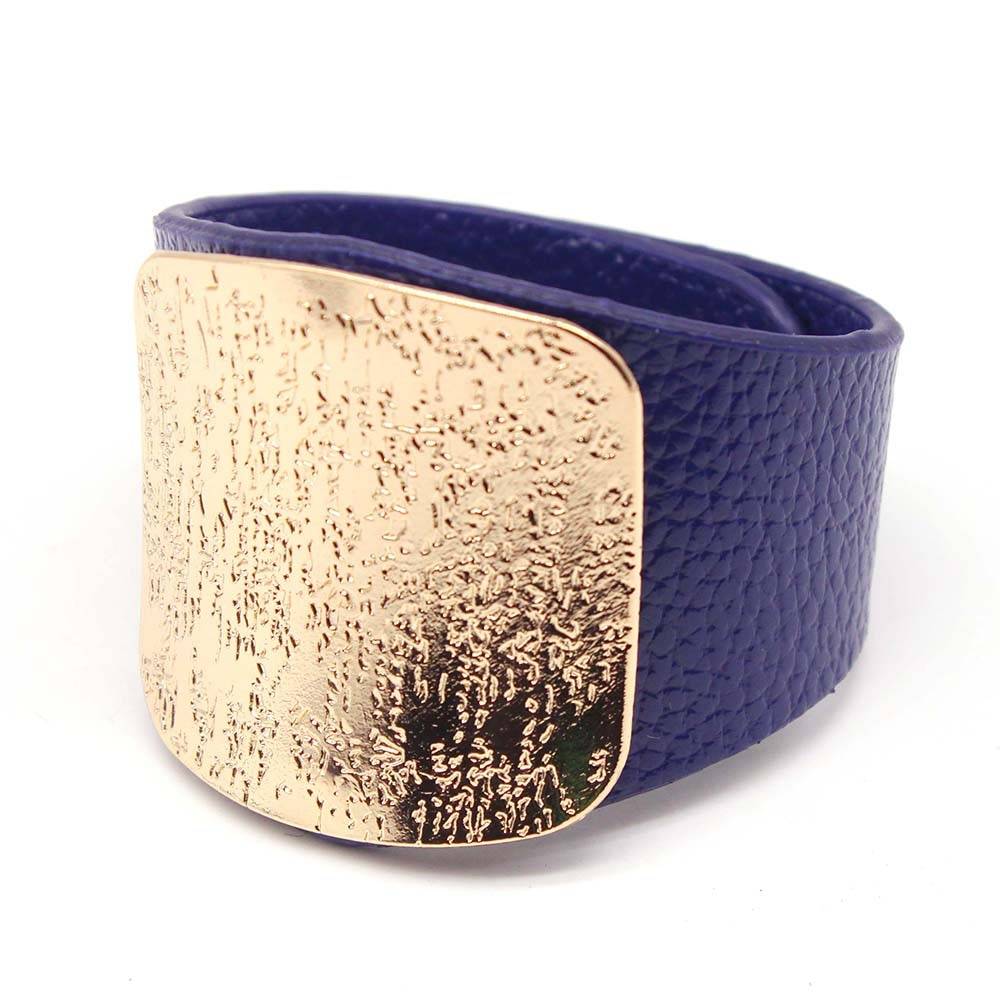 Deep blue leather hair cuff with a textured gold plate, designed for locs, sisterlocks, and dreadlocks. A stylish and secure hair accessory.