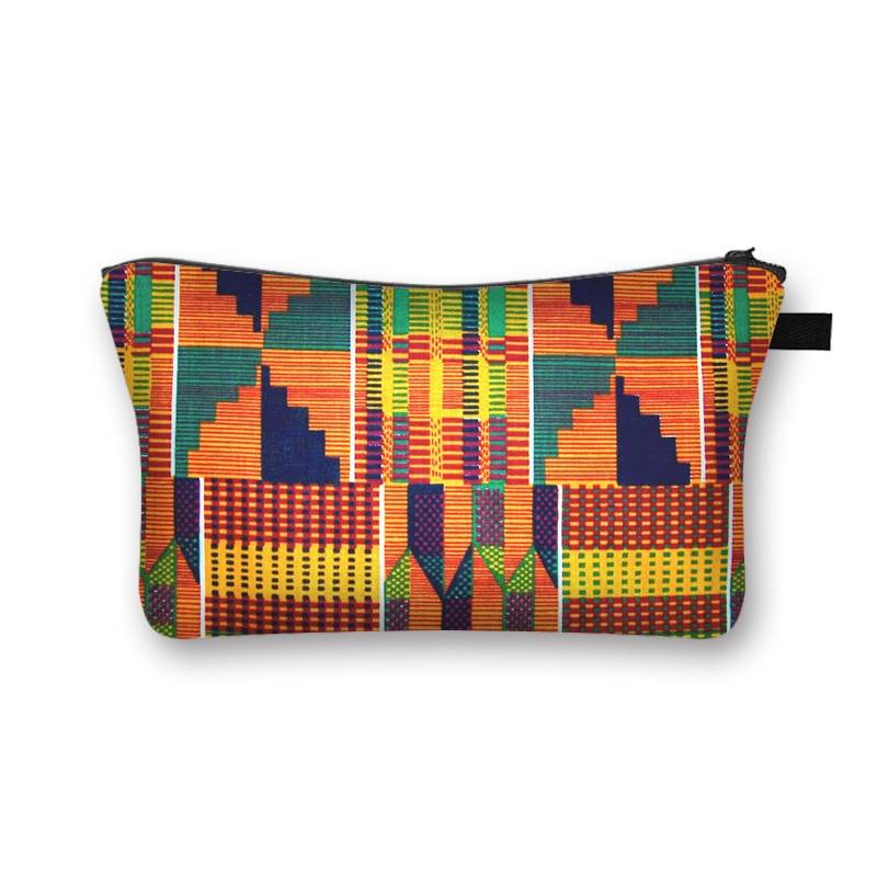 Kente-inspired African print makeup bag with bold orange, green, and blue geometric patterns. Spacious and lined for beauty storage.
