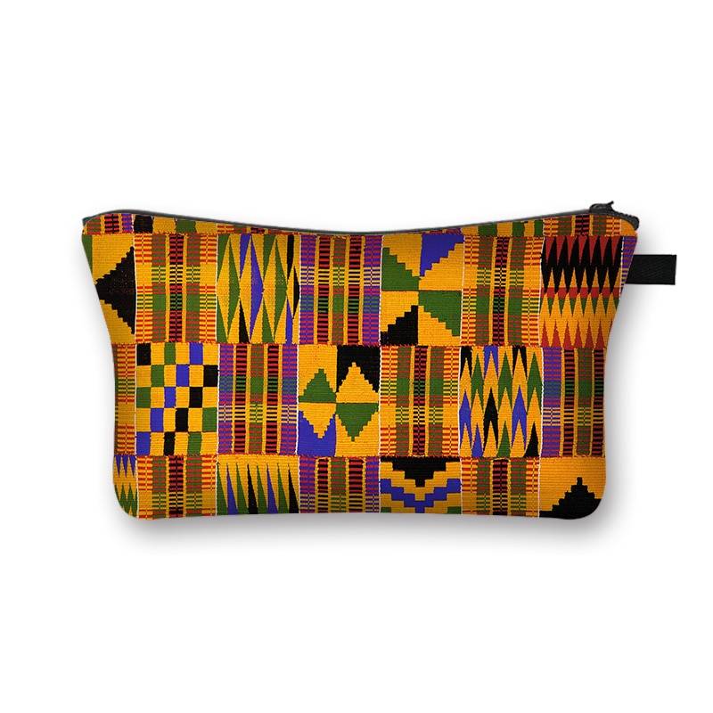 Kente-inspired African print makeup bag with bold yellow, green, and black geometric patterns. Spacious and lined for beauty storage.