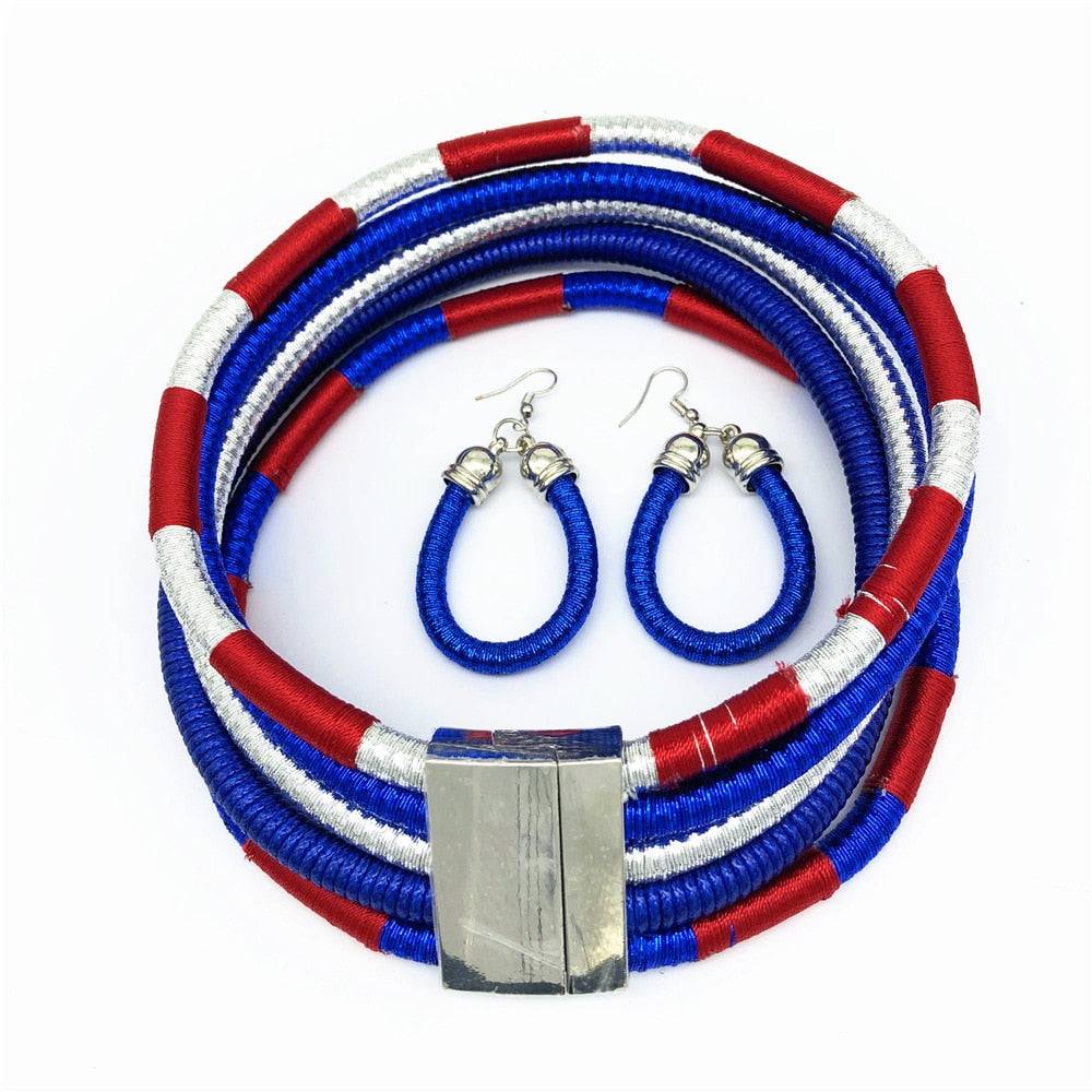 Striking African choker multi-layer necklace set in blue, red, and silver with matching earrings. A perfect statement jewelry piece for cultural fashion.