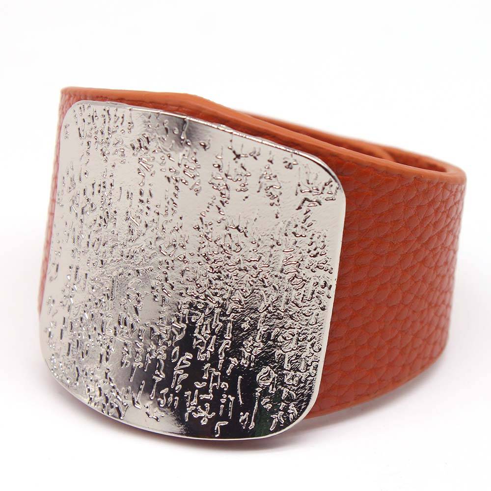 Brown leather hair cuff with a textured silver plate, designed for locs, sisterlocks, and dreadlocks. A stylish and non-damaging hair accessory.