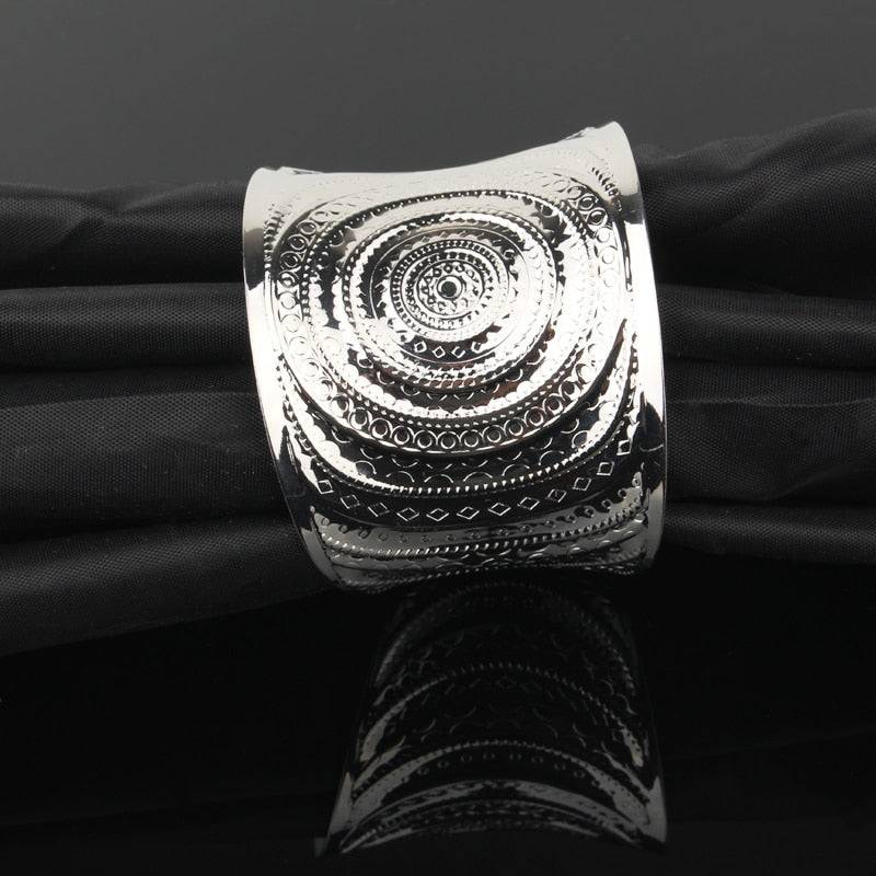 Silver-tone engraved hair cuff with intricate circular patterns for locs, sisterlocks, dreadlocks, and braids. Adjustable and non-damaging hair accessory.