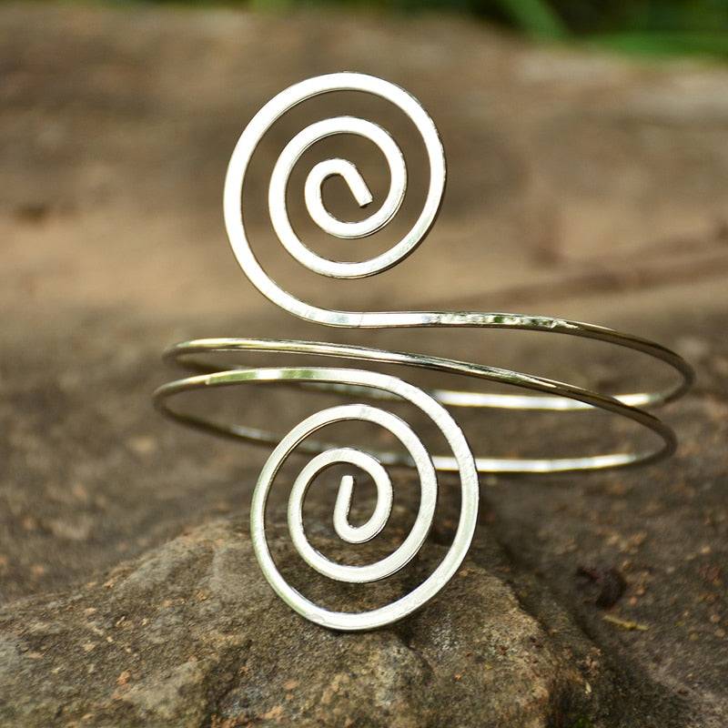Silver and gold adjustable hair cuff with spiral design for locs, sisterlocks, braidlocs, dreadlocks, and braids. Stylish non-damaging hair accessory.