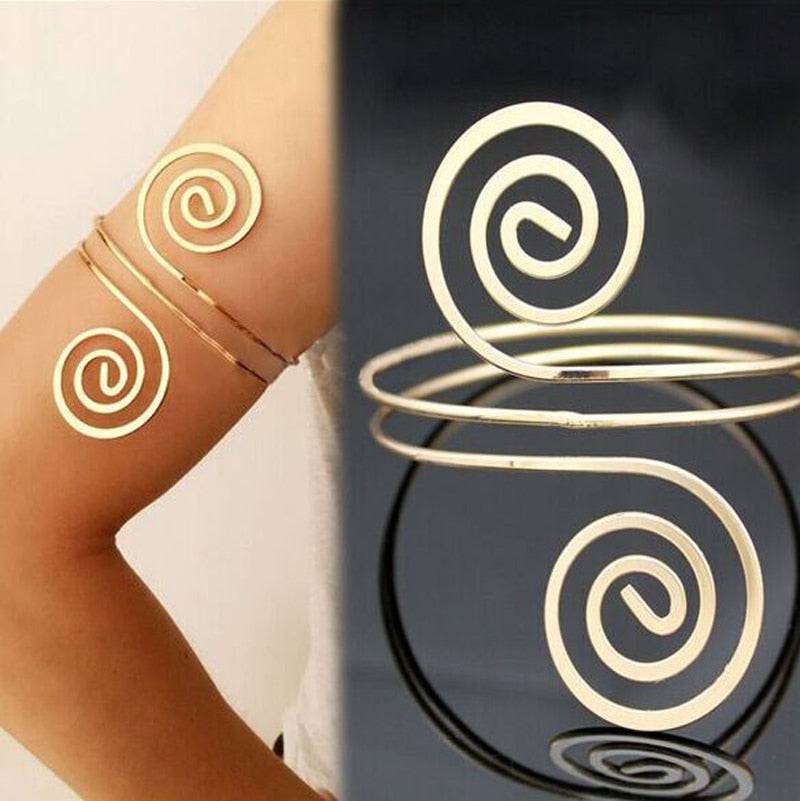 Gold spiral arm cuff bracelet worn on the upper arm, also suitable as a hair cuff for locs, sisterlocks, braidlocs, dreadlocks, and braids. Trendy and versatile.