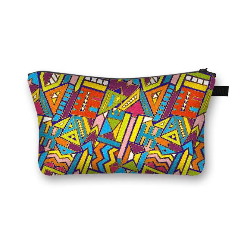Colorful geometric African print makeup bag with vibrant tribal patterns. Stylish and lined cosmetic pouch for beauty essentials.
