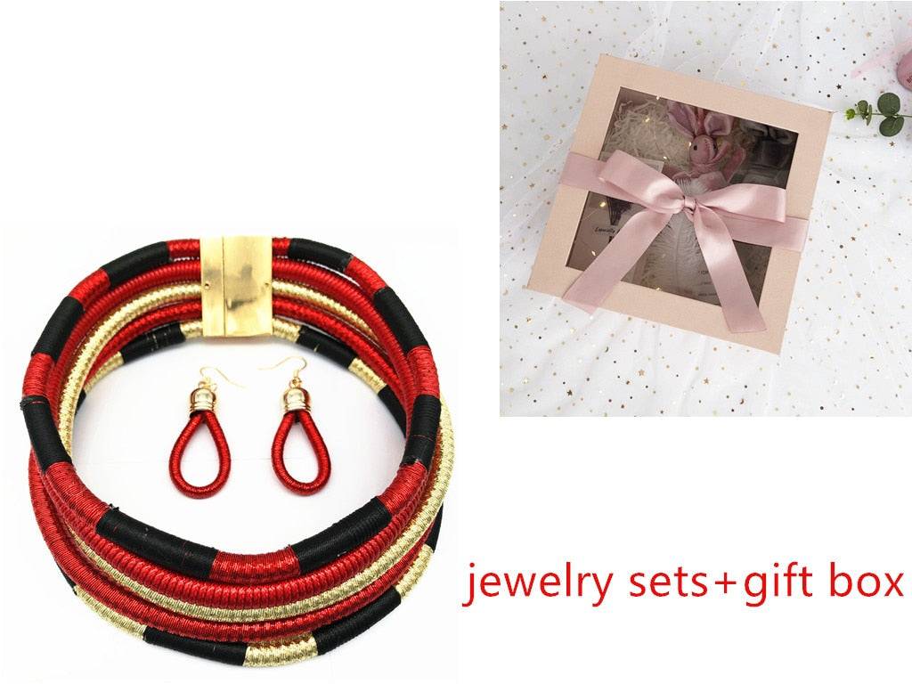 Bold red, black, and gold African choker multi-layer necklace set with matching earrings and a gift box. A stunning jewelry gift for cultural fashion lovers.