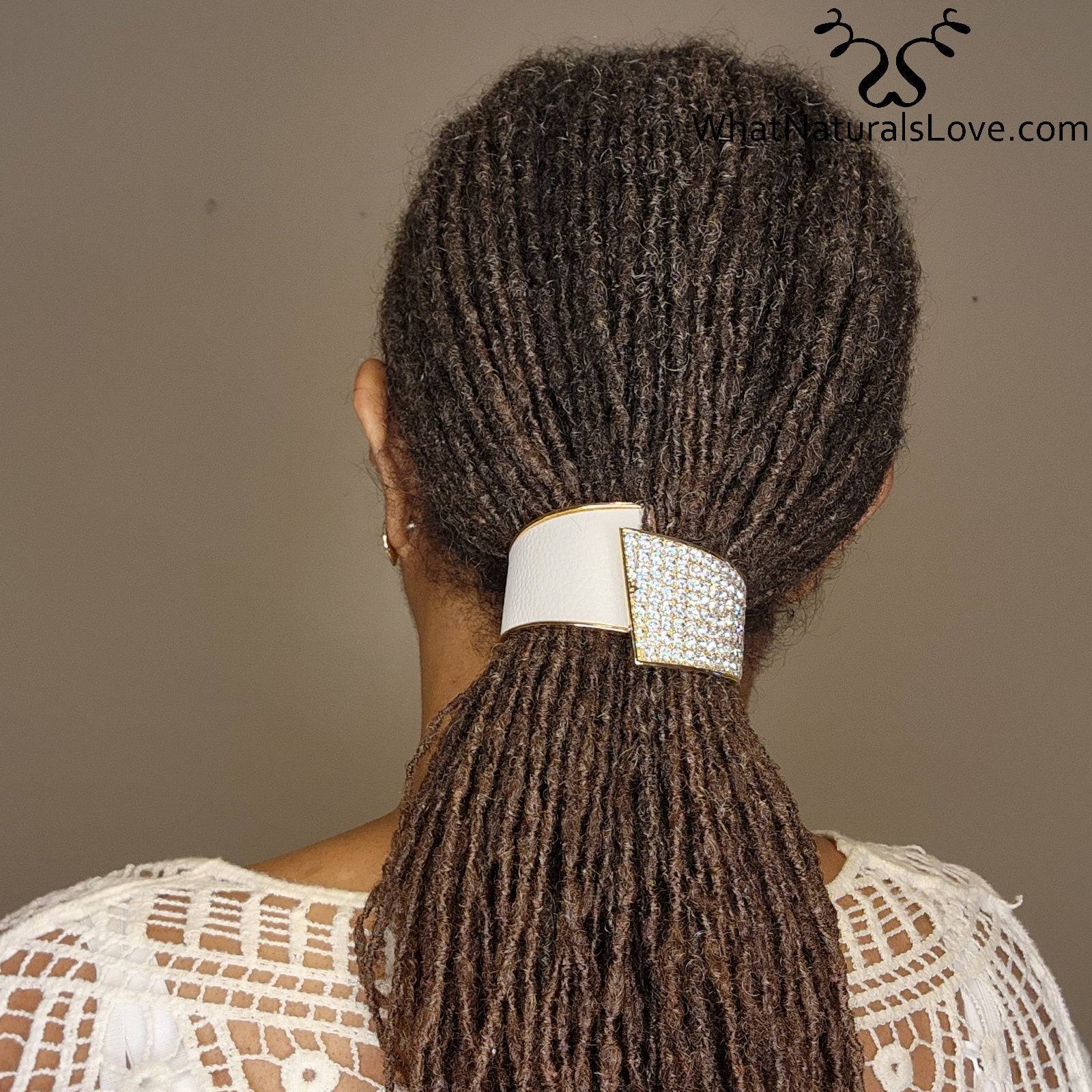 Elegant rhinestone hair cuff securing locs in a ponytail. A stylish and functional accessory for dreadlocks, braids, and curls.
