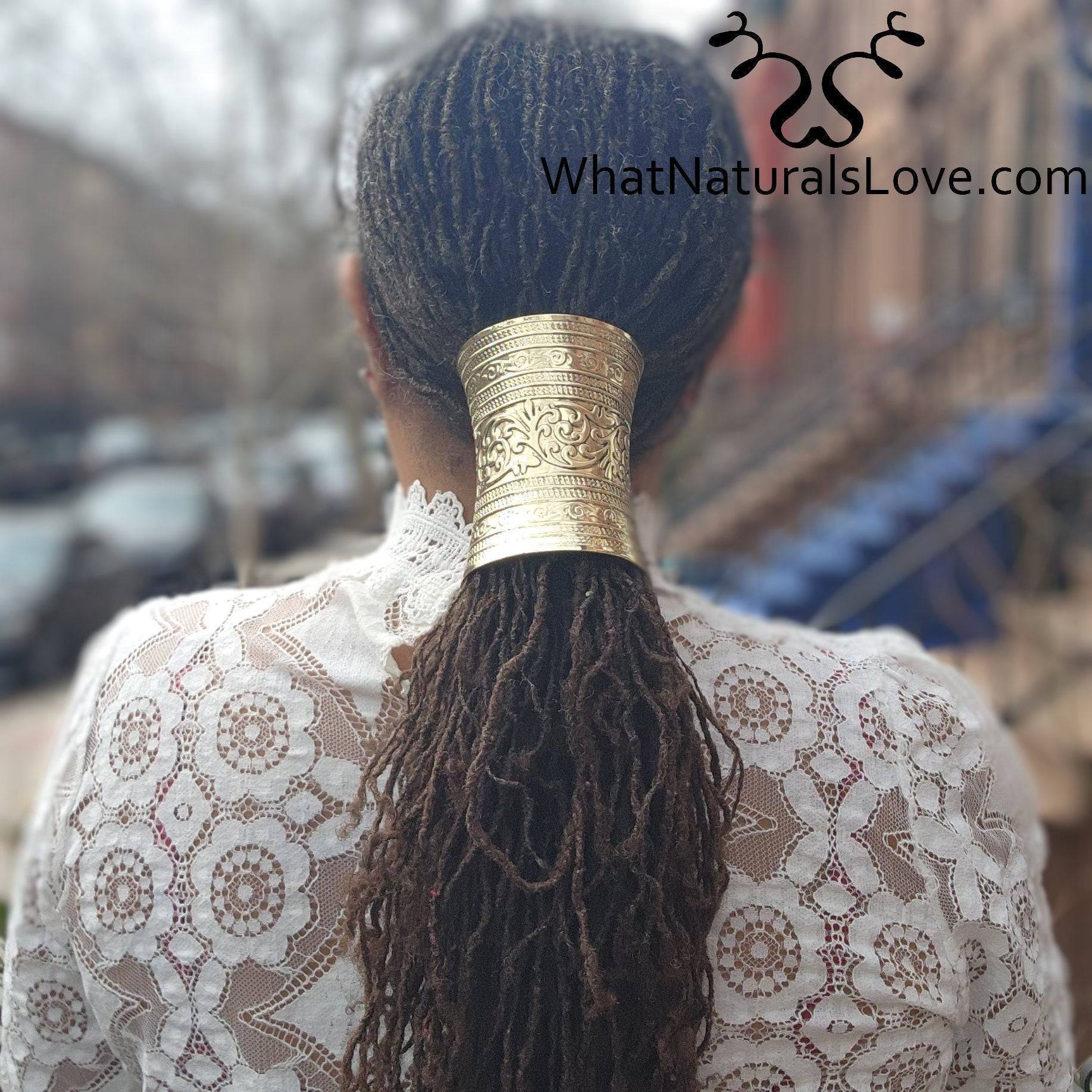 Back view of a woman wearing an adjustable ancient gold hair cuff securing her long locs, perfect for dreadlocks, Sisterlocks, and ponytails.