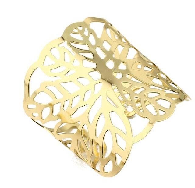 Gold-tone openwork leaf hair cuff for locs, sisterlocks, dreadlocks, and braids. Elegant and non-damaging ponytail holder for stylish hairdos.