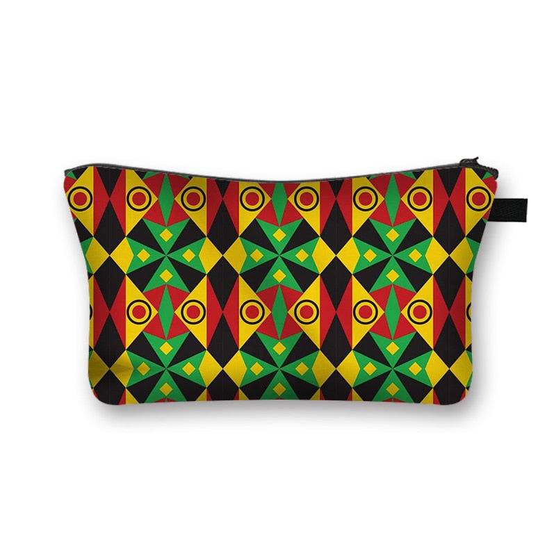 African print makeup bag with bold red, yellow, and green diamond patterns. Stylish and lined cosmetic pouch with a secure zipper.