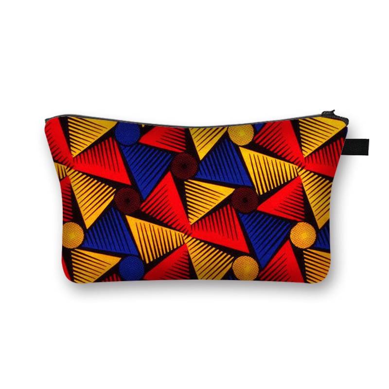 Vibrant African print makeup bag featuring geometric red, yellow, and blue triangle patterns. Durable and lined for beauty essentials.