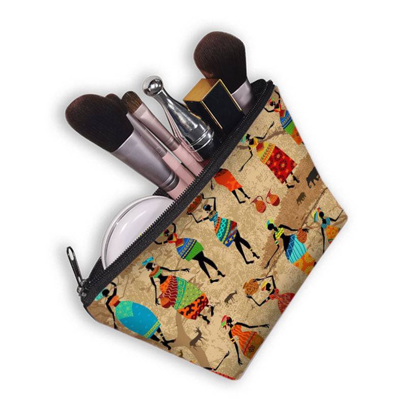 African print makeup bag with dancing women, shown open with makeup brushes. Stylish and lined cosmetic pouch for beauty essentials.