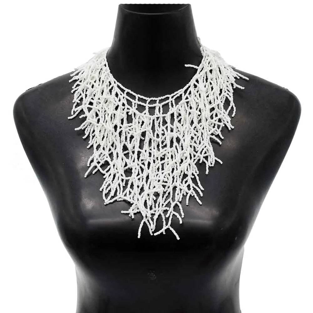 Elegant white beaded necklace with intricate coral-like design, ideal for Memorial Day 2024. A handmade African necklace displayed on a black mannequin.