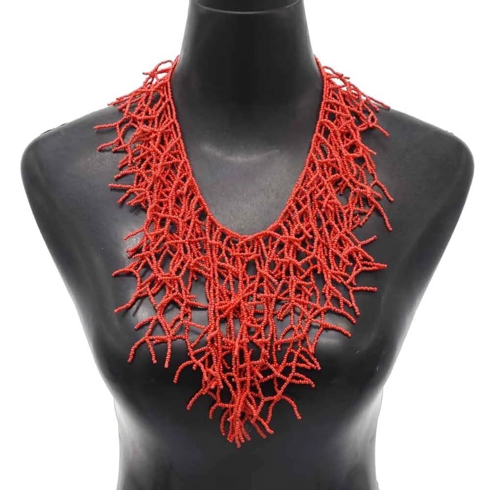 Handmade red beaded necklace with intricate coral-like design, perfect for Memorial Day 2024. Elegant African necklace displayed on a black mannequin.