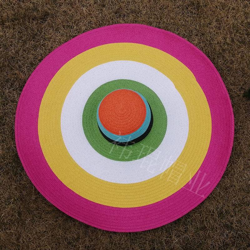 Colorful oversized 27-inch wide brim sun hat with pink, yellow, and green rings, perfect for summer fun.