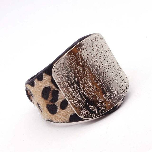 Leopard print leather hair cuff with a textured silver plate, perfect for locs, sisterlocks, and dreadlocks. A bold and trendy hair accessory.