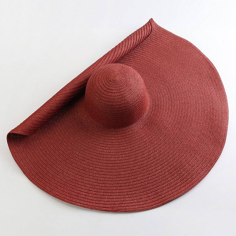 Rich red oversized 27-inch wide brim sun hat, a bold and stylish summer accessory.