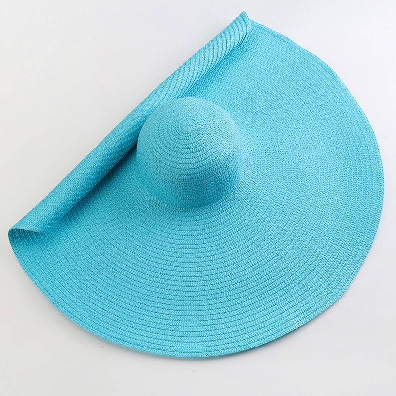 Vibrant blue oversized 27-inch wide brim sun hat, a stylish and functional summer accessory.