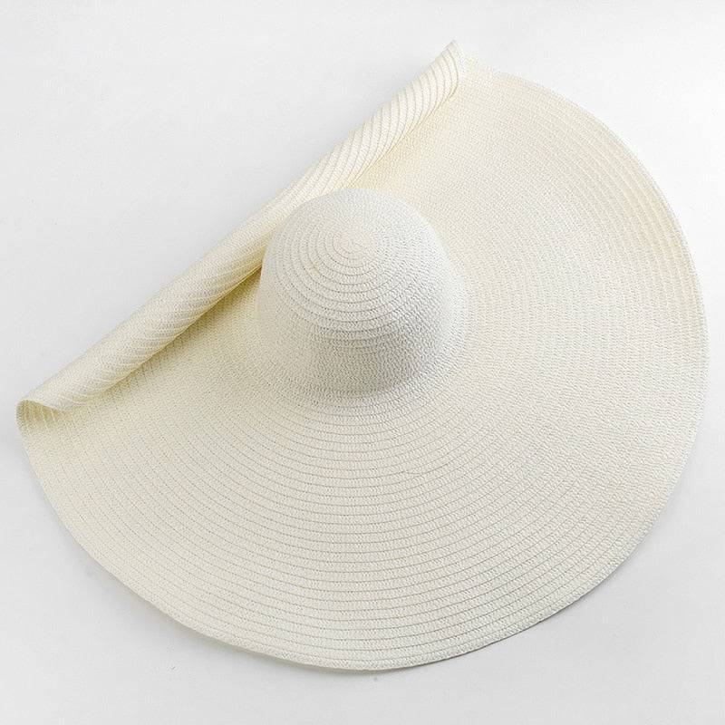 Elegant white oversized 27-inch wide brim sun hat, ideal for summer fashion and sun safety.