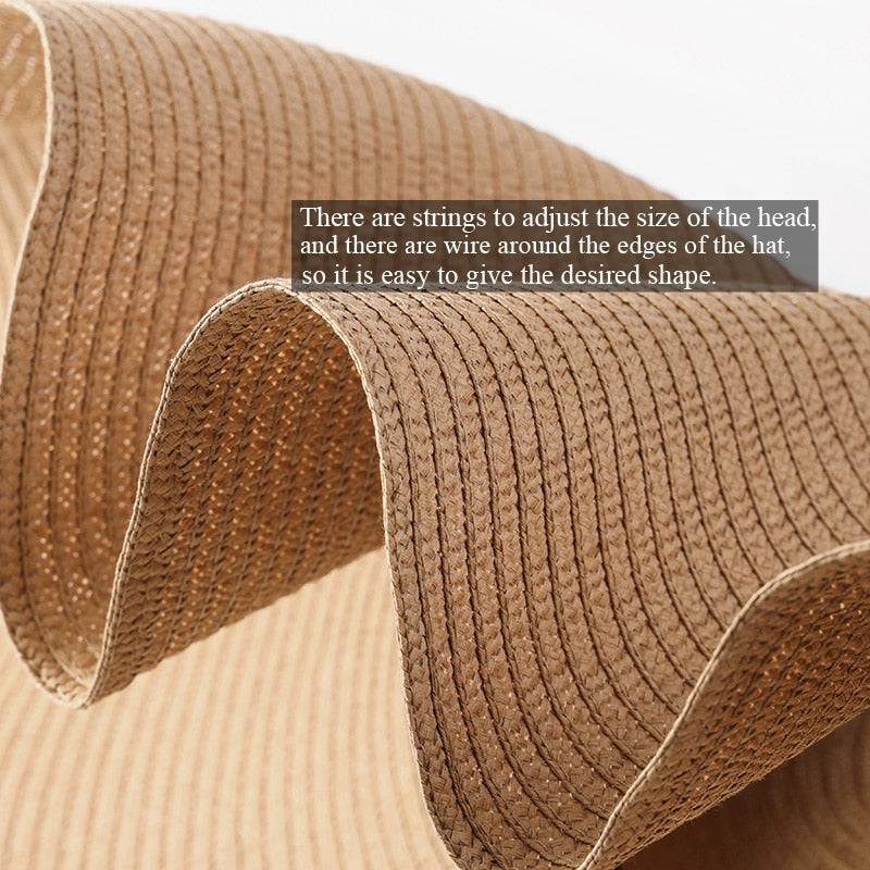 Close-up of beige oversized 27-inch wide brim sun hat with adjustable strings and flexible wire edges.