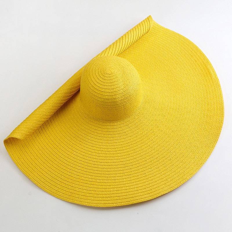 Bright yellow oversized 27-inch wide brim sun hat, perfect for summer beach outings and sun protection.