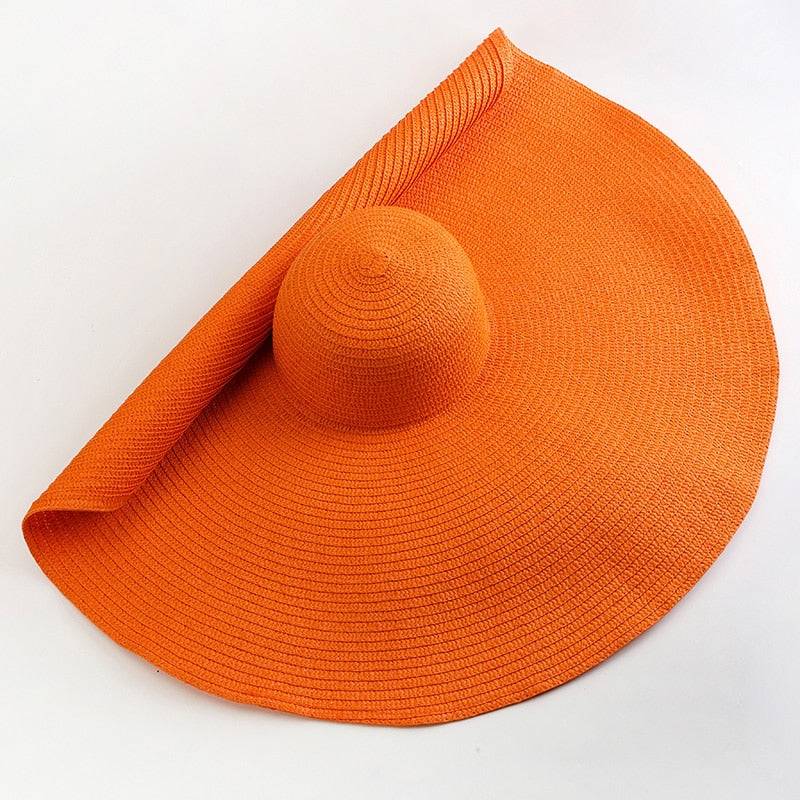 Vibrant orange oversized 27-inch wide brim sun hat, perfect for stylish sun protection.