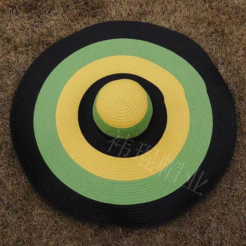 Multicolor oversized 27-inch wide brim sun hat with black, yellow, and green rings, a bold summer statement.