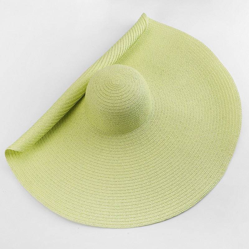 Light green oversized 27-inch wide brim sun hat, perfect for outdoor sun protection and summer fashion.