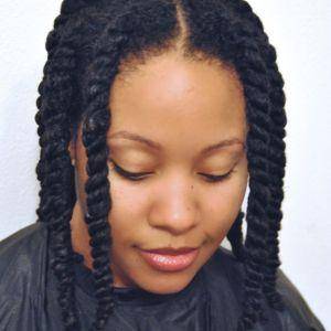 Natural 4C hair styled in twists after using the Painless Detangler Brush, showing defined curls and minimal breakage.