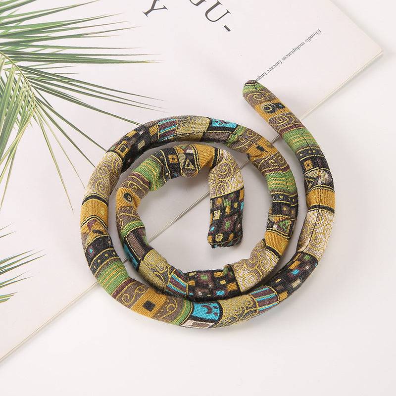 Brown and gold moldable hair tie with intricate patterns. Perfect for securing locs, Sisterlocks, and braids.