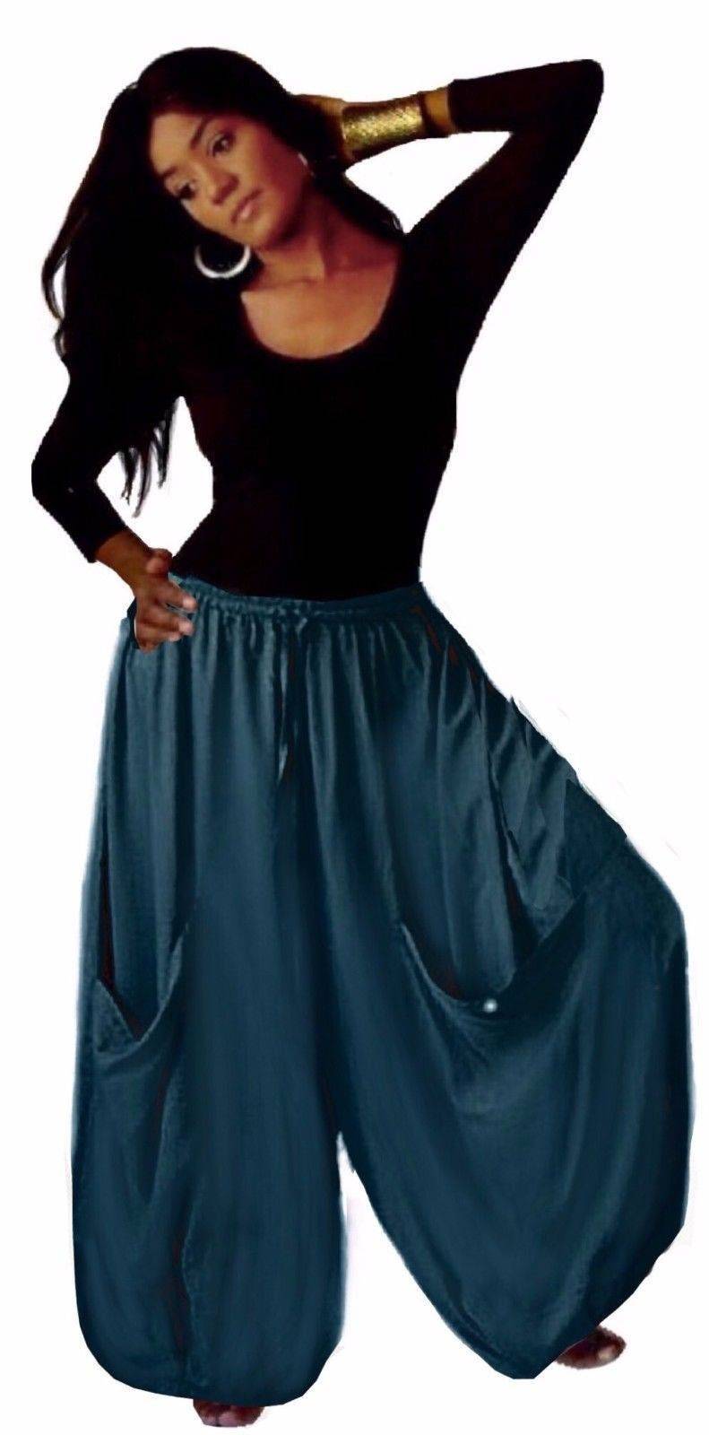 Teal wide-leg gauchos pants featuring an elastic waist, drawstring, and big pockets, designed for a stylish and relaxed fit.