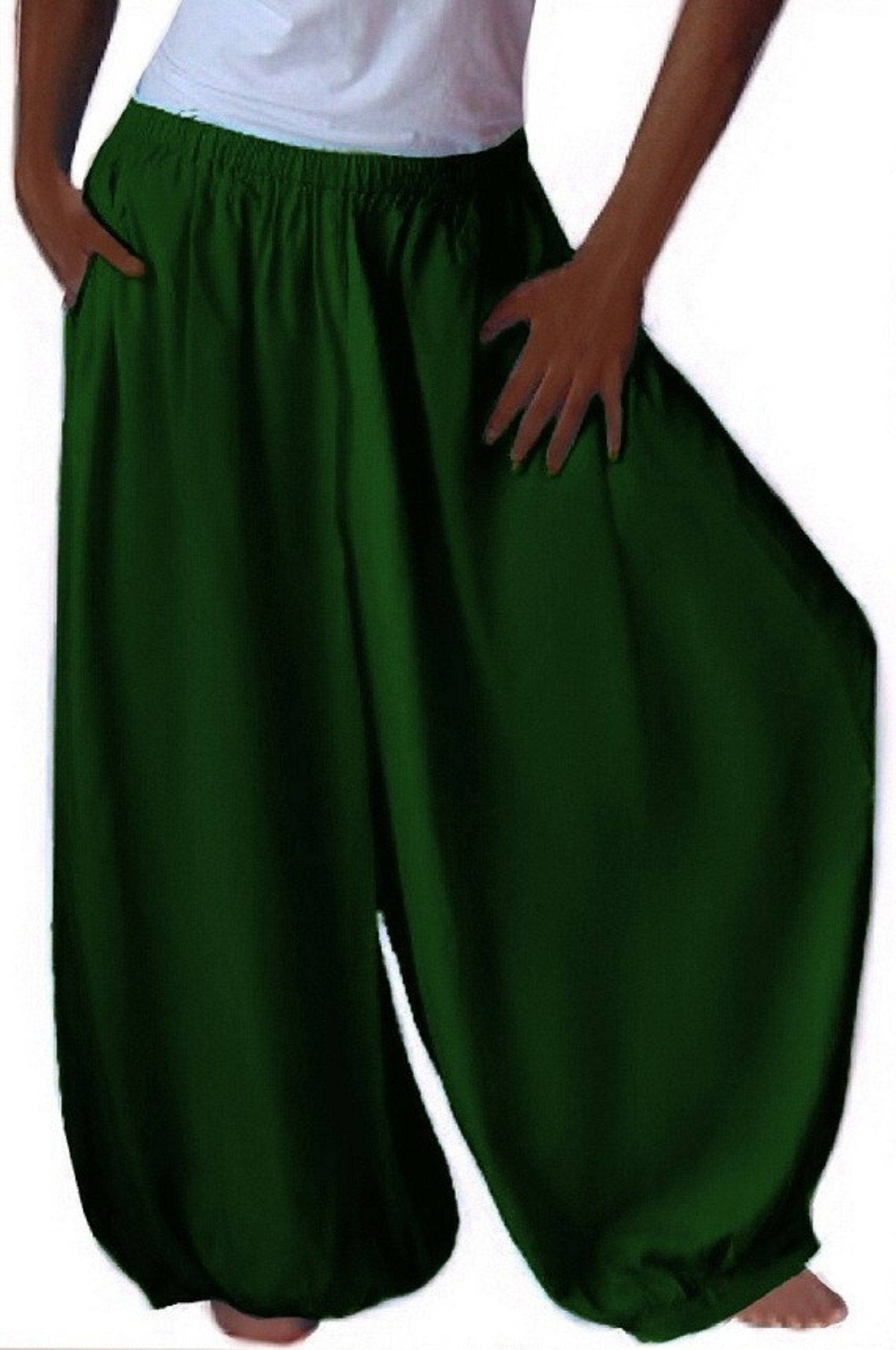 Green overall harem hippy pants with wide leg gaucho, plus size. Loose-fitting and flowy boho-style pants with an elastic waistband and pockets.