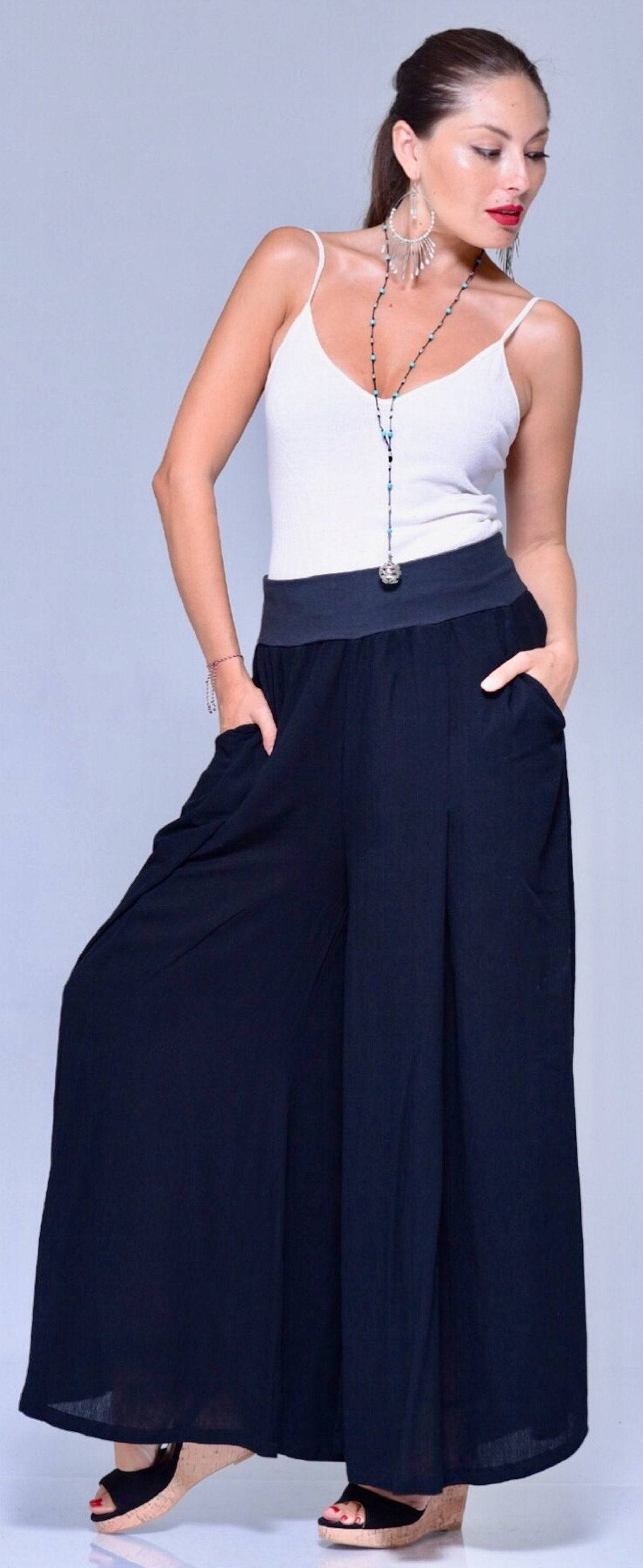 Black plus size Lycra waist palazzo pants with wide leg and pockets. Comfortable and stylish women&