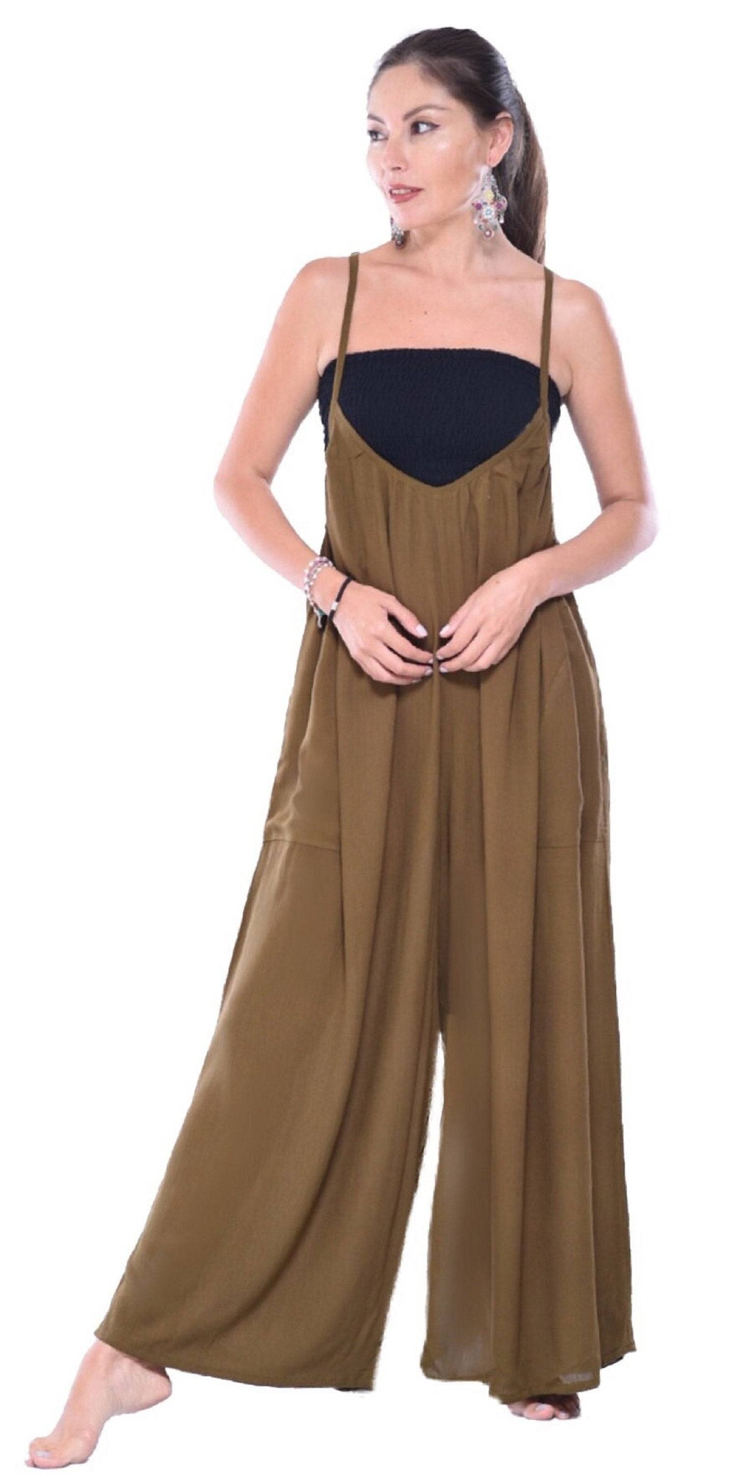 Brown wide-leg jumpsuit with thin straps and pockets. Relaxed and stylish fit for casual occasions.