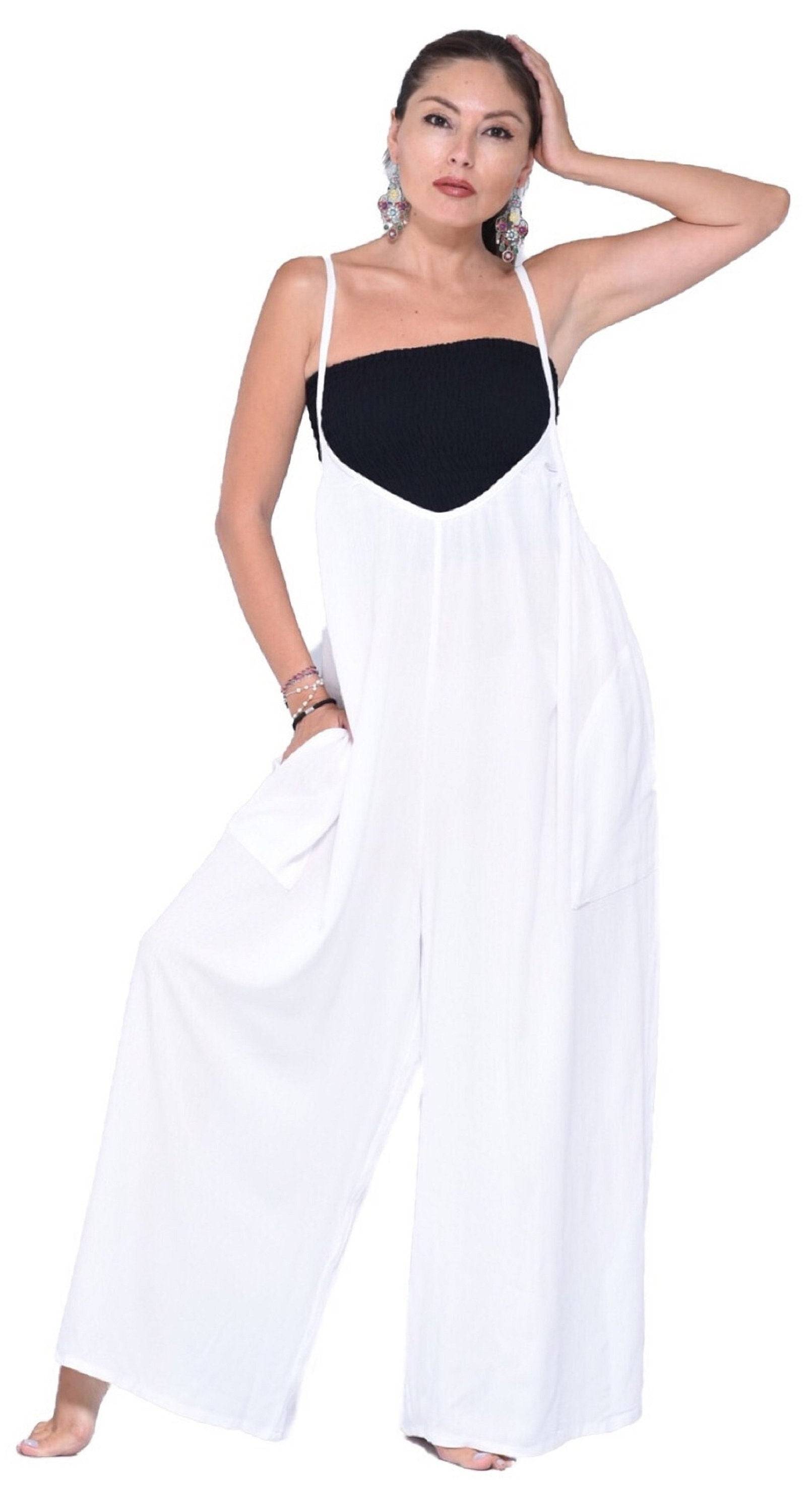 White overalls thin straps jumpsuit with pockets and wide-leg fit. Elegant and breathable fabric for all sizes.