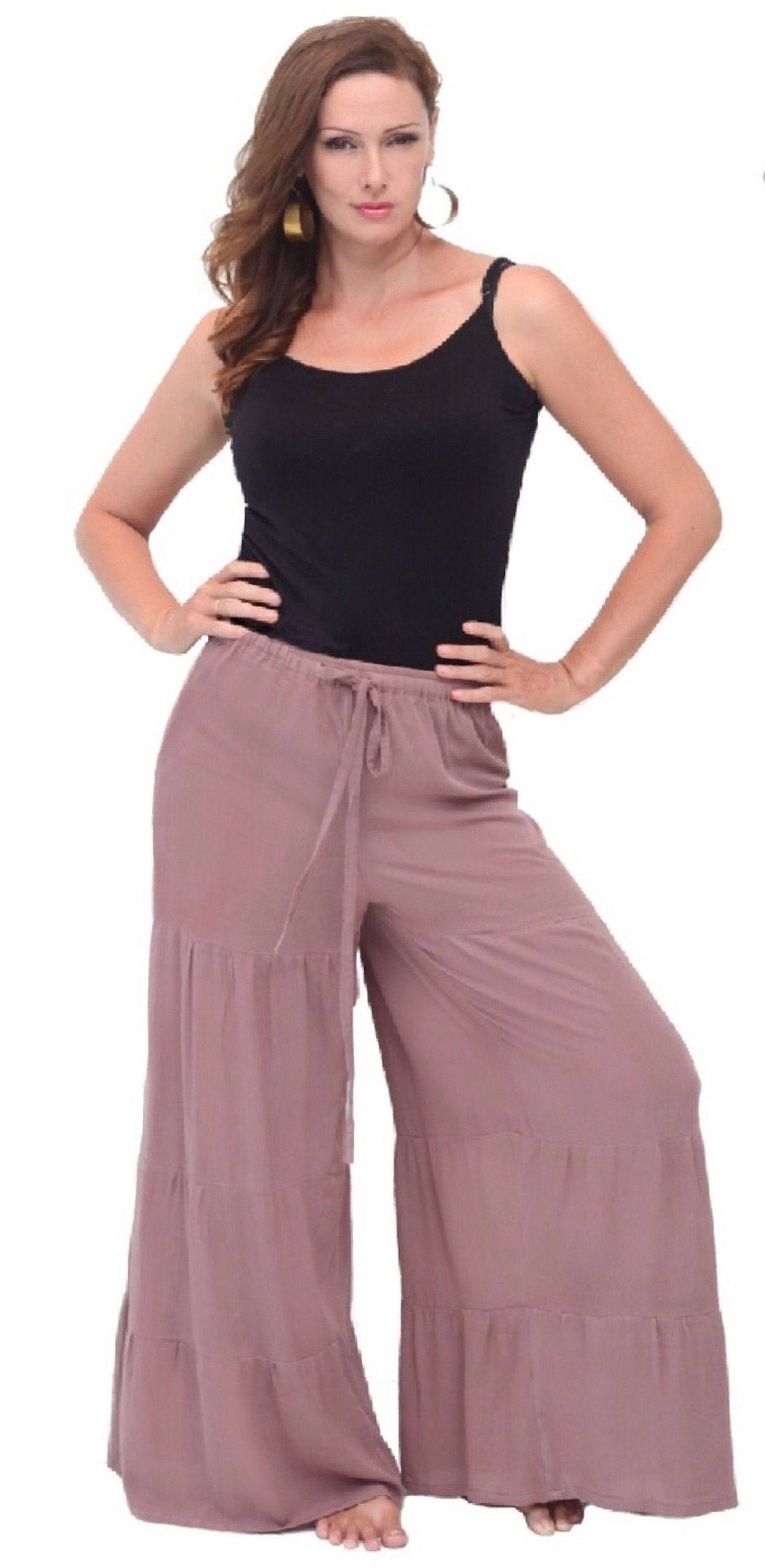 Mauve long ruffled crinkle rayon pants with a wide leg and elasticized waist. A stylish and comfortable choice for women&