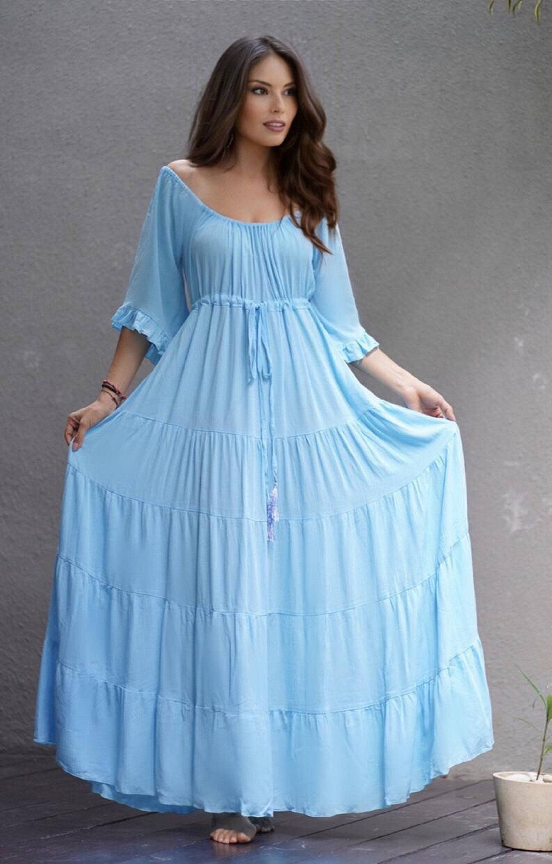 Light blue maxi dress with sleeves, featuring a flowing silhouette and empire waist. A perfect choice for boho, Viking renaissance, or Wiccan-inspired outfits.